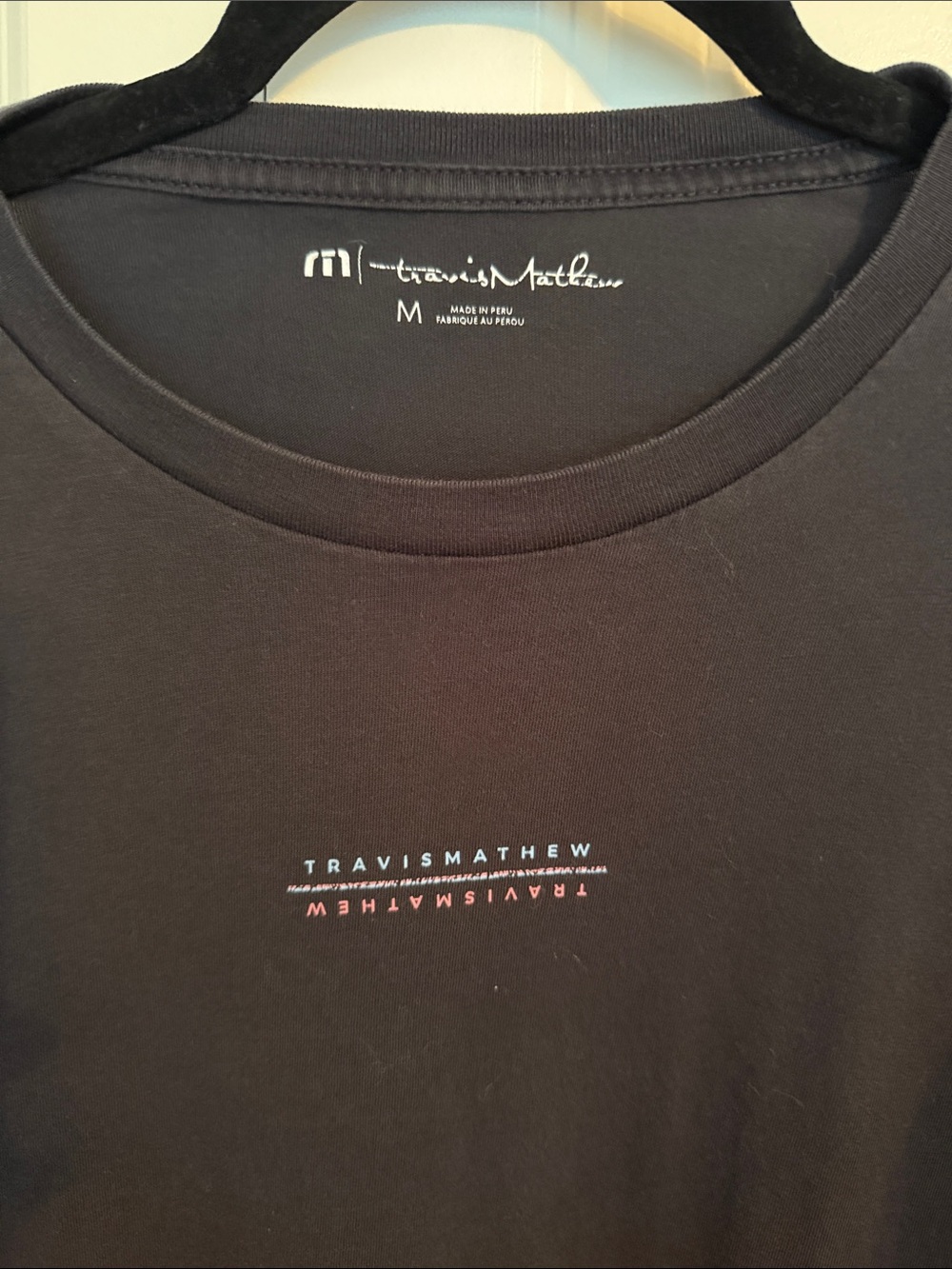 Travis Mathew Black Short Sleeve Crew Neck Tee with Center Logo